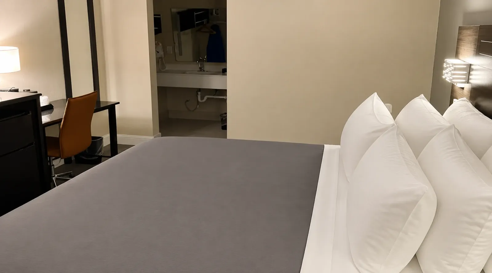 ADA accessible king room at Lx Hotel Manchester TN with king bed and seating area