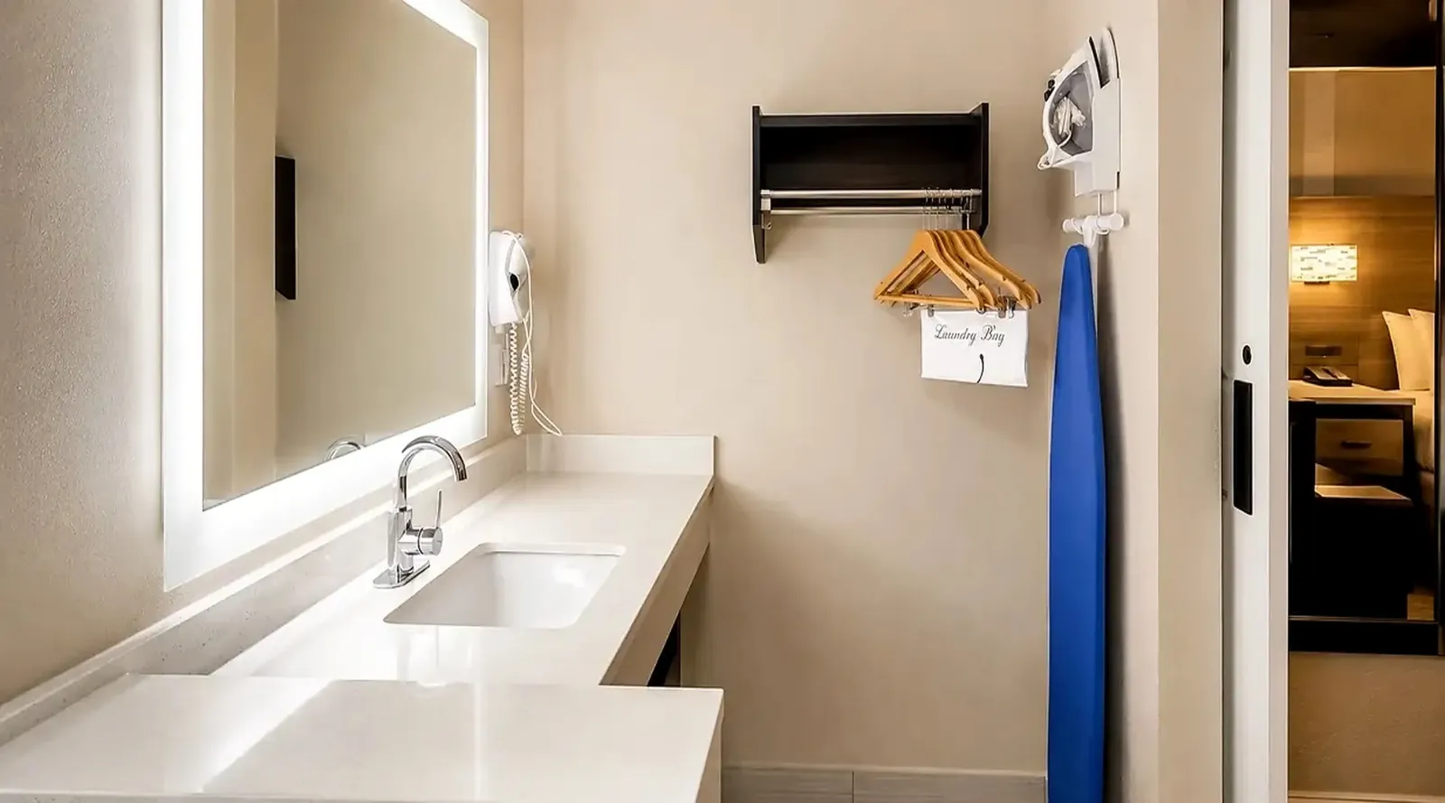 Double queen room ensuite bathroom at Lx Hotel Manchester TN with vanity and shower