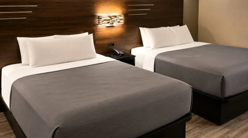 Double queen room at Lx Hotel Manchester TN ideal for families with plush bedding
