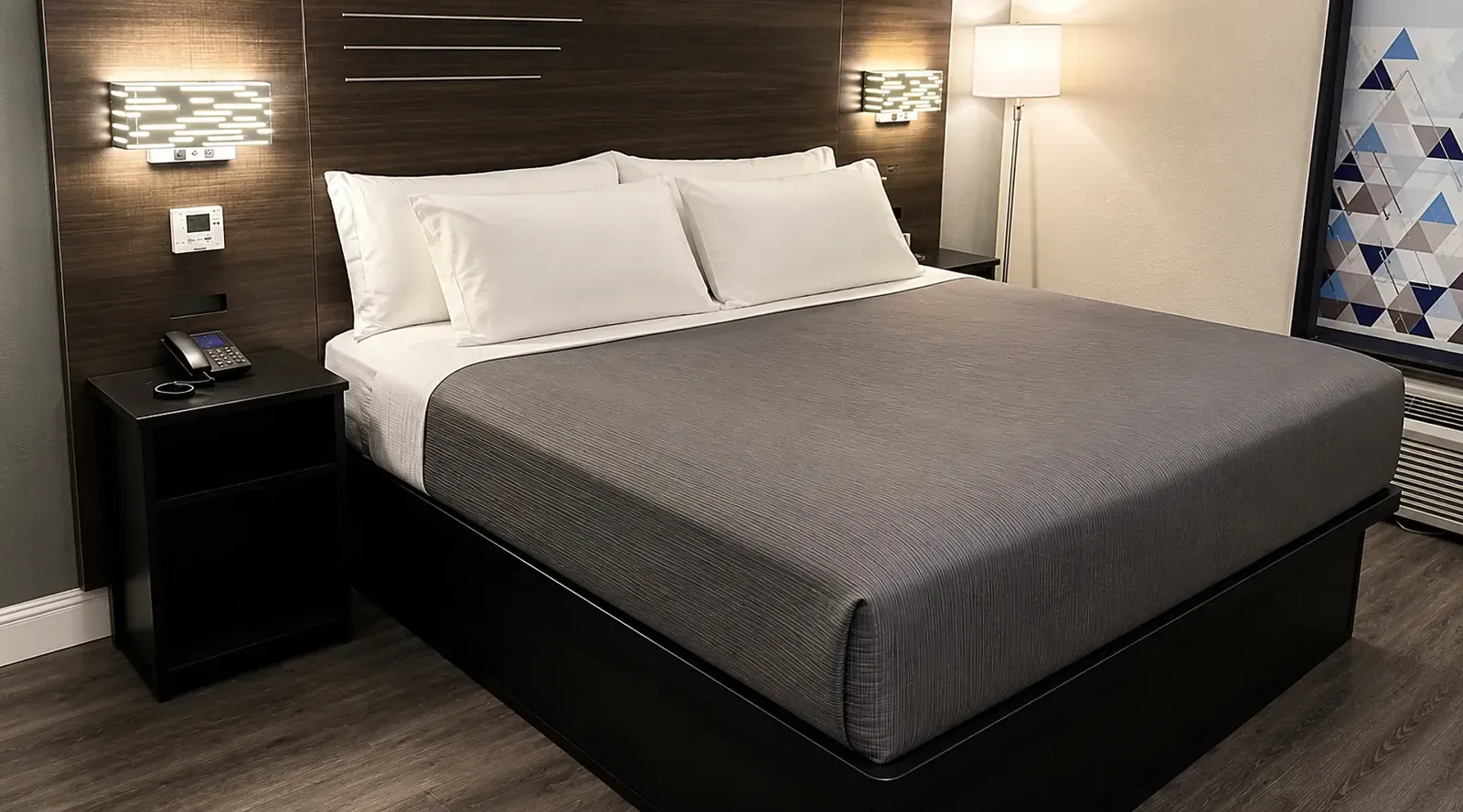 Spacious king guest room at Lx Hotel Manchester TN with premium bedding, work desk, and modern amenities