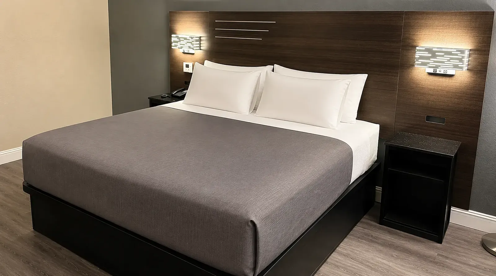 King room at Lx Hotel Manchester TN with sofa, coffee table, and ensuite bath access