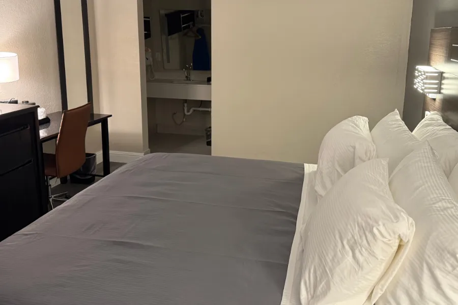 ADA king room at Lx Hotel with accessible king bed and seating