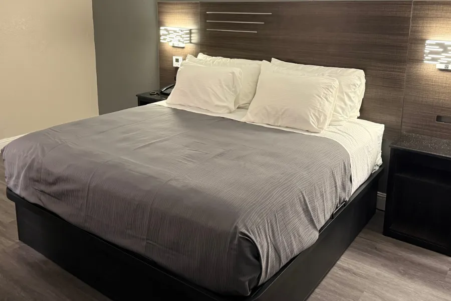 Regular king room at Lx Hotel with plush king bed